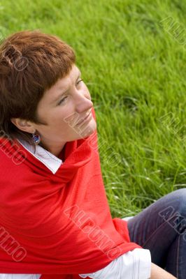 woman sitting on the grass