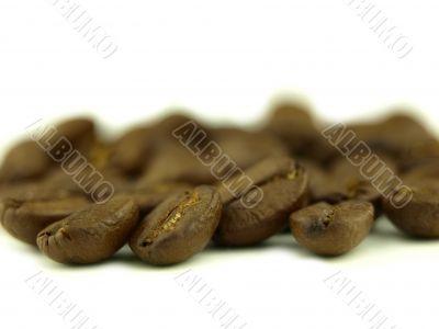 Coffee beans very close and coffee in zoom