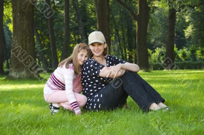 Mother and daughter on lawn
