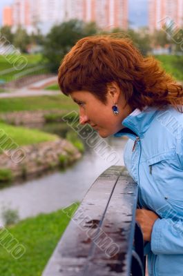 redhead woman on the bridge
