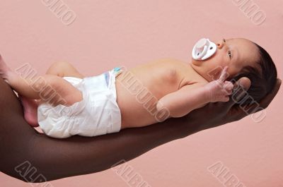 Newborn baby on the arm