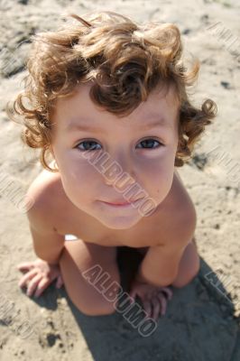 Funny photo of the child on the beach
