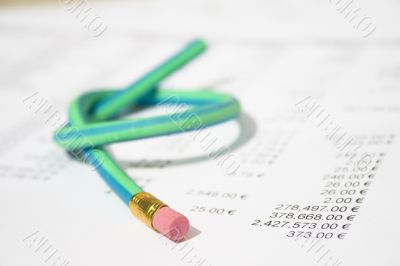 Green rubber pencil twisted into a knot