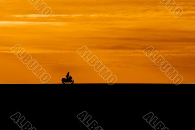 silhouette of biker silhouette of biker