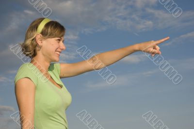 Young girl pointing somewhere Young girl pointing somewhere
