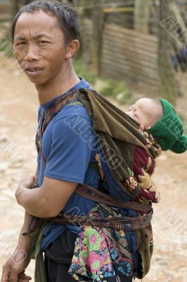 Father with baby in Laos