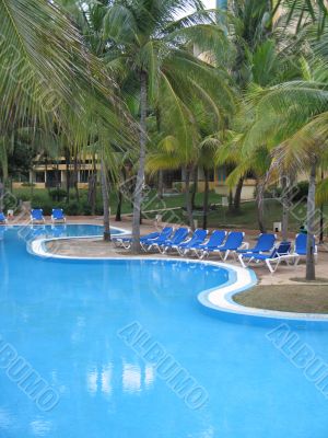 blue pool in a tropical setting