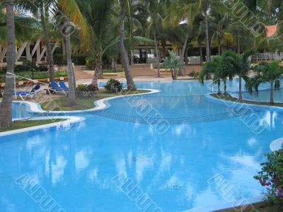 blue pool in a tropical setting