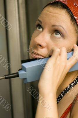 girl having a call on a telephone