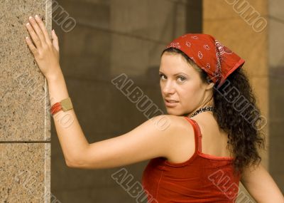 pretty brunet woman  near column