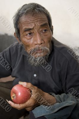 old asian man with apple
