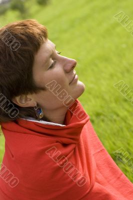 woman sitting on the grass