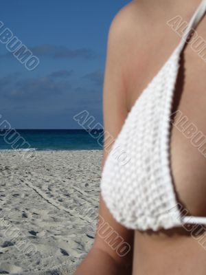 female breast in a white bikini female breast in a white bikini