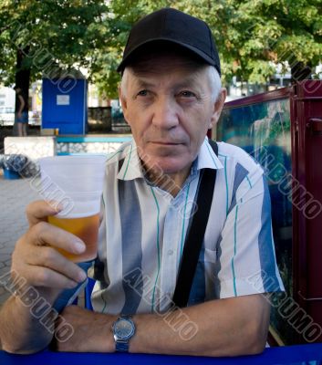 elderly man with beer