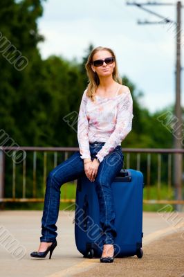 young lady waiting a train