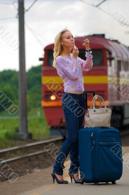 young lady waiting a train