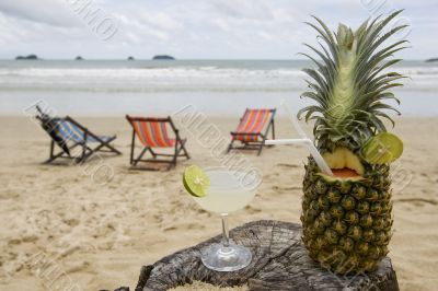 Pineapple, cocktail on the beach