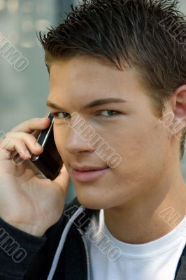 Portrait of a young man with mobile phone Portrait of a young man with mobile phone