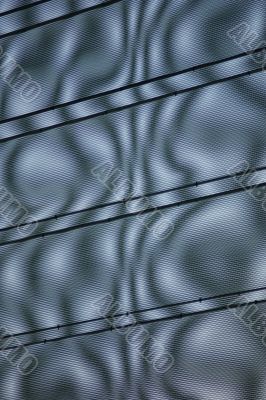 Light playing in a grid covering a car park