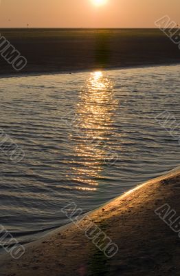 sunrise on the beach on ameland, the netherlands