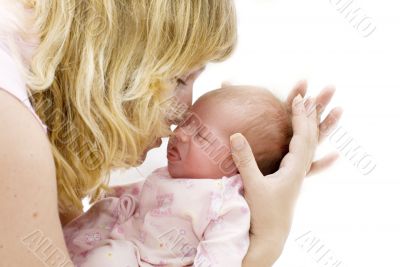 mother kissing her child