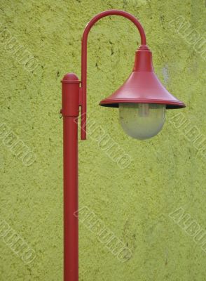 red street light in front of a yellow light