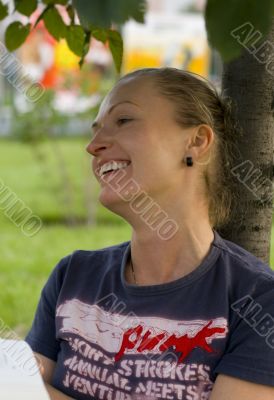  laughing woman under the tree