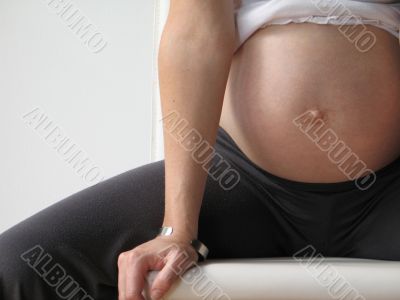 belly of a pregnant young woman