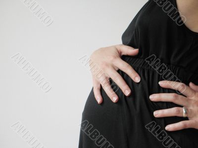 belly of a pregnant young woman