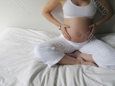 belly of a pregnant young woman belly of a pregnant young woman