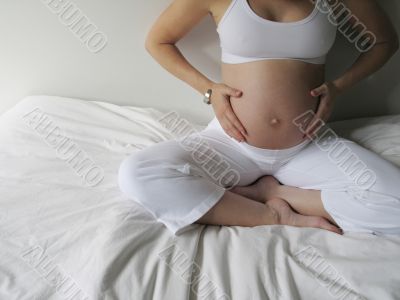 belly of a pregnant young woman