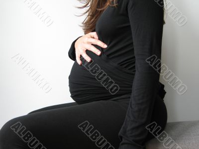 belly of a pregnant young woman