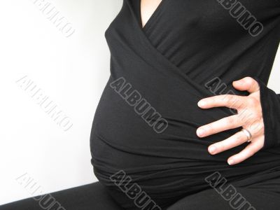 belly of a pregnant young woman