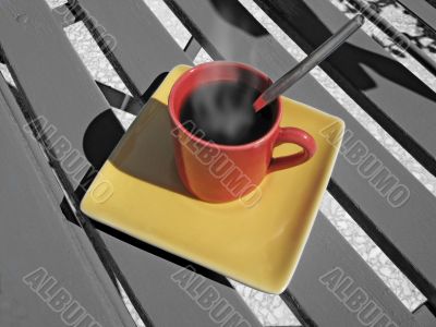 steaming coffee cup on a chair