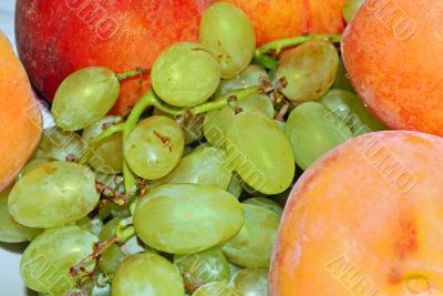appetizing bunch of grapes and peach