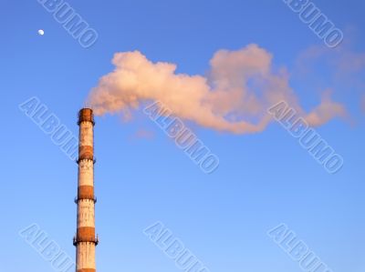 Smoking factory pipe and moon