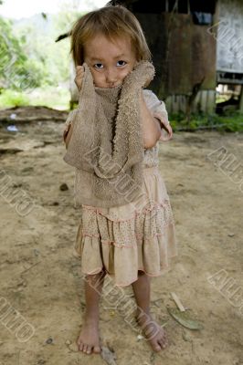 Hmong girl with a dirty cloth, Laos