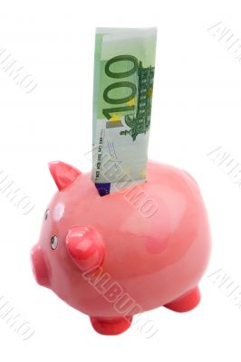 Note of one hundred of euros in a piggy-bank