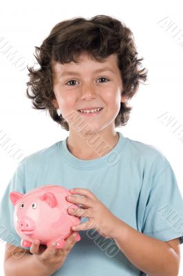 Adorable boy with pink piggy bank