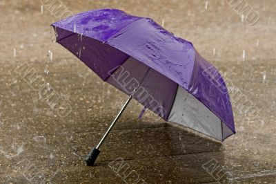 Umbrella at intense rainy weather