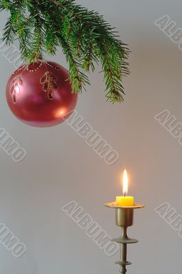  fir-tree  twig and red bal with candle