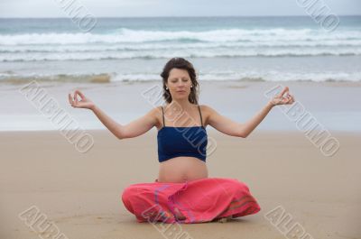Beautiful pregnant girl practicing yoga