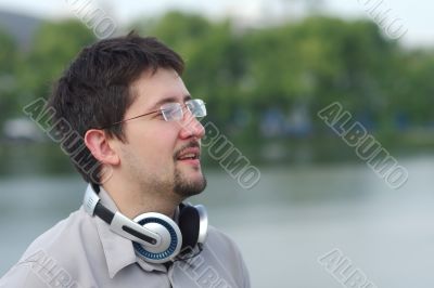Young smiling man with headphones