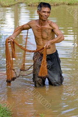 Fisherman of Thailand with throw net