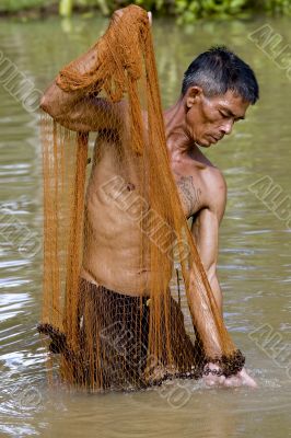 Fisherman of Thailand with throw net