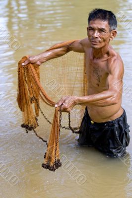 Fisherman of Thailand with throw net