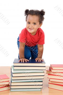 Baby climb up over a pile of books