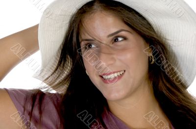 charming young model holding her hat charming young model holding her hat