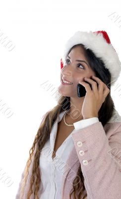 lady wearing santacap and holding mobile