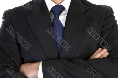 businessman in suit with crossed arms